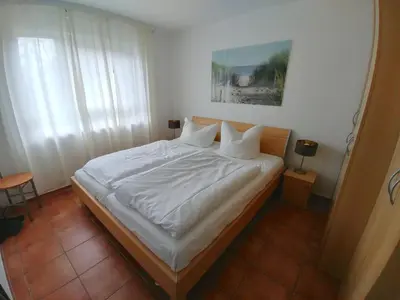 Ein Bett oder Betten in einem Zimmer der Unterkunft Fewo65 Residenz am Strand