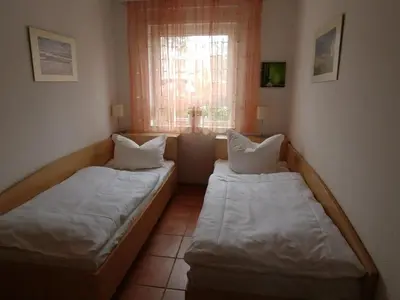 Ein Bett oder Betten in einem Zimmer der Unterkunft Fewo65 Residenz am Strand