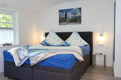 Ein Bett oder Betten in einem Zimmer der Unterkunft Kleine Veranda