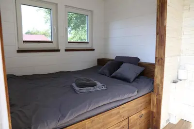 Ein Bett oder Betten in einem Zimmer der Unterkunft Ostsee Tiny Haus Rotkehlchen