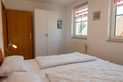 Ein Bett oder Betten in einem Zimmer der Unterkunft Feriendomizil Zingst