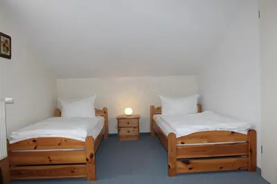 Ein Bett oder Betten in einem Zimmer der Unterkunft FeWo Marion