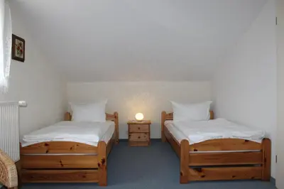 Ein Bett oder Betten in einem Zimmer der Unterkunft FeWo Marion