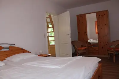 Ein Bett oder Betten in einem Zimmer der Unterkunft FeWo Marion