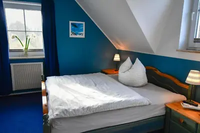 Ein Bett oder Betten in einem Zimmer der Unterkunft Kranich - Ihr Urlaub in Zingst