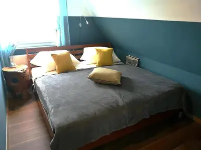 Ein Bett oder Betten in einem Zimmer der Unterkunft Dat Smucke Reethus Dachgeschoss