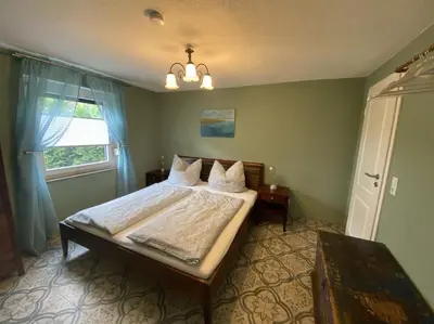 Ein Bett oder Betten in einem Zimmer der Unterkunft Dat Smucke Reethus Erdgeschoss