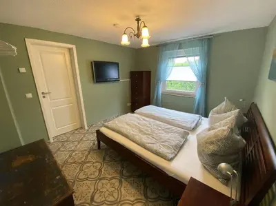 Ein Bett oder Betten in einem Zimmer der Unterkunft Dat Smucke Reethus Erdgeschoss