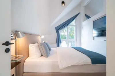 Ein Bett oder Betten in einem Zimmer der Unterkunft Apartment Blausand