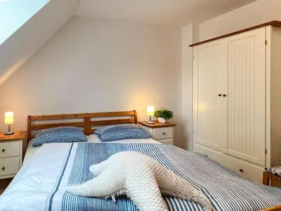 Ein Bett oder Betten in einem Zimmer der Unterkunft Alter Schwede Haus 2