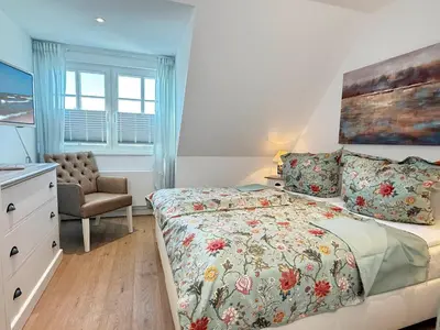 Ein Bett oder Betten in einem Zimmer der Unterkunft Rewal