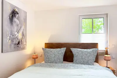 Ein Bett oder Betten in einem Zimmer der Unterkunft Düne 7 Apartment 7 03