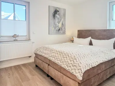 Ein Bett oder Betten in einem Zimmer der Unterkunft Düne 7 Apartment 7 03