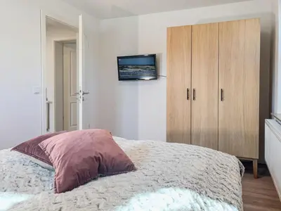 Ein Bett oder Betten in einem Zimmer der Unterkunft Düne 7 Apartment 7 03