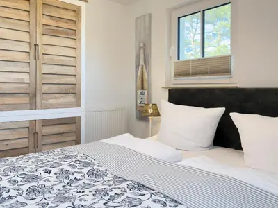 Ein Bett oder Betten in einem Zimmer der Unterkunft Düne 7 Apartment 7 06