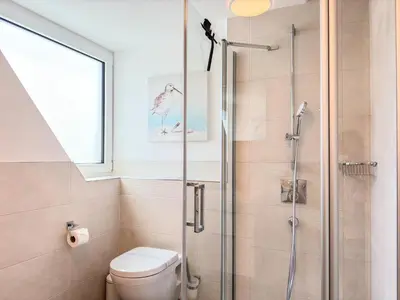 Ein Badezimmer in der Unterkunft Düne 7 Apartment 7A 04