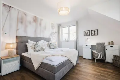 Ein Bett oder Betten in einem Zimmer der Unterkunft Ferienhäuser Baltic Lagoon Haus 12c