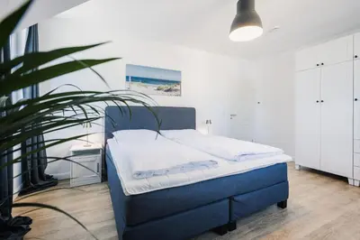 Ein Bett oder Betten in einem Zimmer der Unterkunft Ferienhäuser Baltic Lagoon Haus 16c