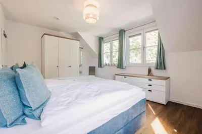 Ein Bett oder Betten in einem Zimmer der Unterkunft Ferienhäuser Baltic Lagoon Haus 14b
