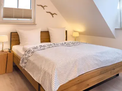 Ein Bett oder Betten in einem Zimmer der Unterkunft Düne 7 Apartment 7A 06