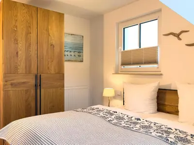 Ein Bett oder Betten in einem Zimmer der Unterkunft Düne 7 Apartment 7A 06