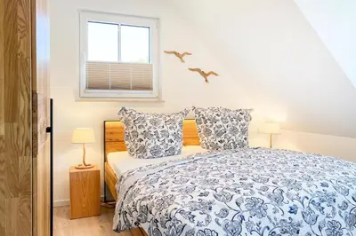 Ein Bett oder Betten in einem Zimmer der Unterkunft Düne 7 Apartment 7A 06