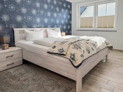 Ein Bett oder Betten in einem Zimmer der Unterkunft Windspiel