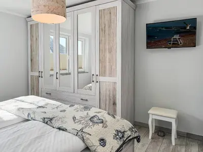 Ein Bett oder Betten in einem Zimmer der Unterkunft Windspiel