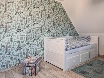 Ein Bett oder Betten in einem Zimmer der Unterkunft Windspiel