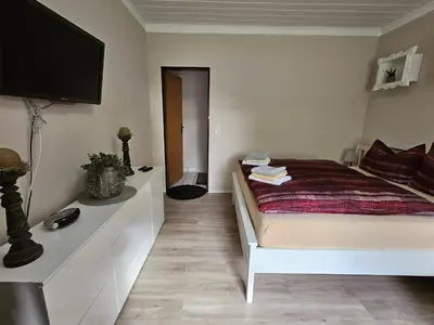 Ein Bett oder Betten in einem Zimmer der Unterkunft Ferienwohnung 2 Am Park