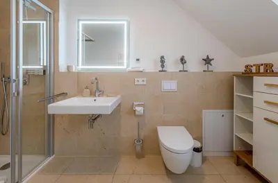 Ein Badezimmer in der Unterkunft 5 Sterne Ferienhaus Ostseenest mit Boddenblick