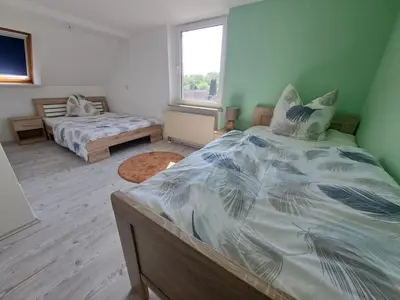Ein Bett oder Betten in einem Zimmer der Unterkunft Ferienwohnung Feldblick