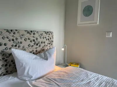 Ein Bett oder Betten in einem Zimmer der Unterkunft Ferienwohnung DREI Hof Himmelgrün