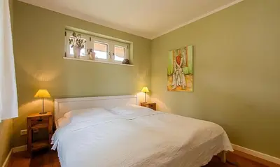 Ein Bett oder Betten in einem Zimmer der Unterkunft Schmugglerhus