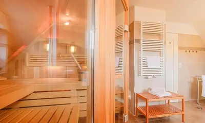 Ein Bett oder Betten in einem Zimmer der Unterkunft Schmugglerhus