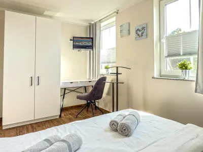Ein Bett oder Betten in einem Zimmer der Unterkunft Wellenbrecher