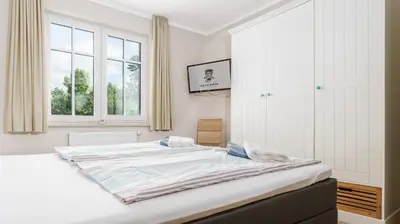 Ein Bett oder Betten in einem Zimmer der Unterkunft Käpt'n Kalle Ferienwohnungen