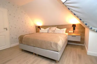 Ein Bett oder Betten in einem Zimmer der Unterkunft Oewern Diek App 59
