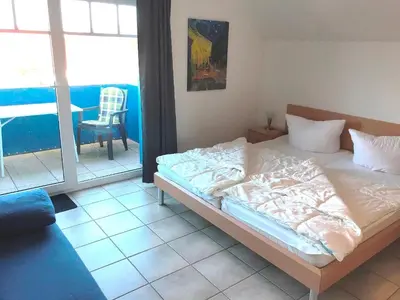 Ein Bett oder Betten in einem Zimmer der Unterkunft Glebbe 17 - Wohnung 8