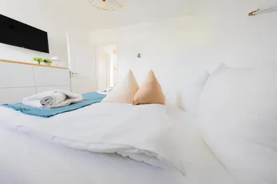 Ein Bett oder Betten in einem Zimmer der Unterkunft Haus Q Superior - Hälfte 1