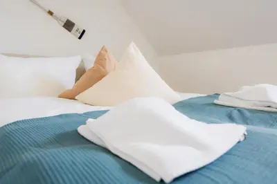 Ein Bett oder Betten in einem Zimmer der Unterkunft Haus Q Superior - Hälfte 1