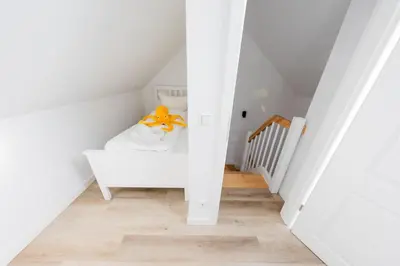Ein Bett oder Betten in einem Zimmer der Unterkunft Haus Q Superior - Hälfte 1
