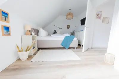 Ein Bett oder Betten in einem Zimmer der Unterkunft Haus Q Superior - Hälfte 1