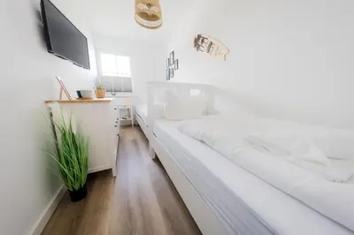 Ein Bett oder Betten in einem Zimmer der Unterkunft Haus Q Superior - Hälfte 2