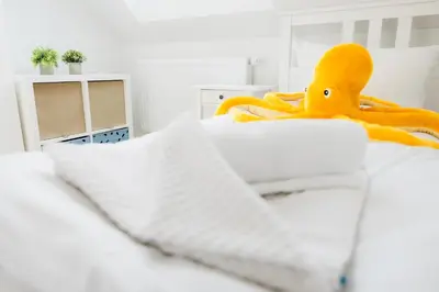 Ein Bett oder Betten in einem Zimmer der Unterkunft Haus Q Superior - Hälfte 2