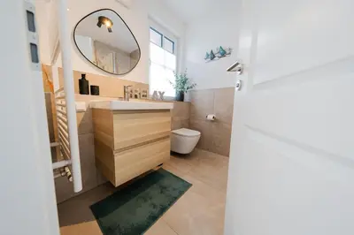 Ein Badezimmer in der Unterkunft Haus Q Superior - Hälfte 2
