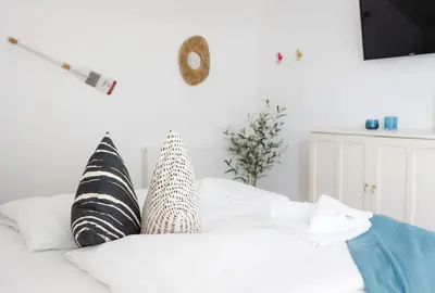 Ein Bett oder Betten in einem Zimmer der Unterkunft Haus Q Superior - Hälfte 2