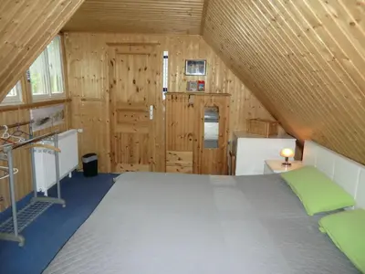 Ein Bett oder Betten in einem Zimmer der Unterkunft Ferienhaus Zingst MinHus