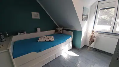 Ein Bett oder Betten in einem Zimmer der Unterkunft FW Leuchtturm