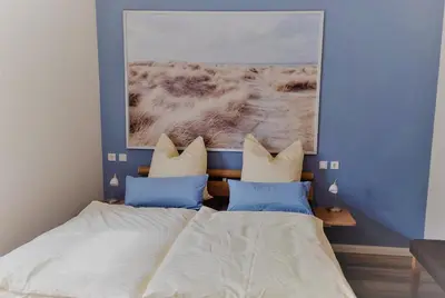 Ein Bett oder Betten in einem Zimmer der Unterkunft Kleine-Ostseeliebe